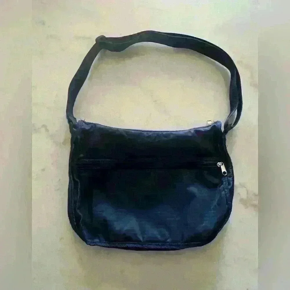 American Tourister dark blue nylon adjustable strap crossbody bag.
